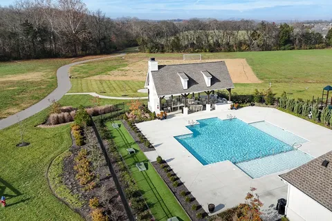 a view of a swimming pool with a patio
