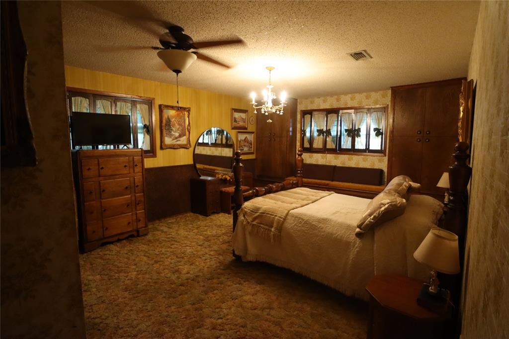 301 Travis Street Ranger, TX 76470 - Photo 12 of 31 a bedroom with a bed and a television
