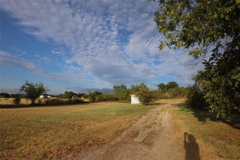 301 Travis Street Ranger, TX 76470 - Photo 2 of 31 a view of lake with mountain in background