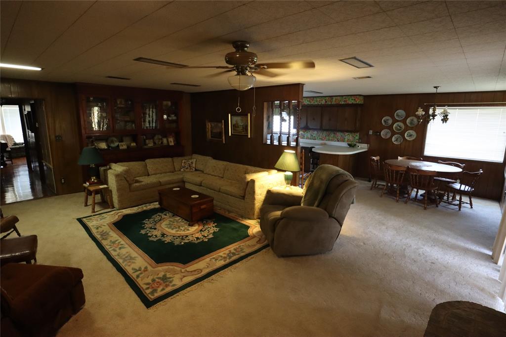 301 Travis Street Ranger, TX 76470 - Photo 23 of 31 a living room with furniture and a fireplace