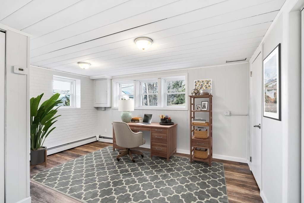 340 Berlin Road Marlborough, MA 01752 - Photo 11 of 42 a living room with furniture and a potted plant