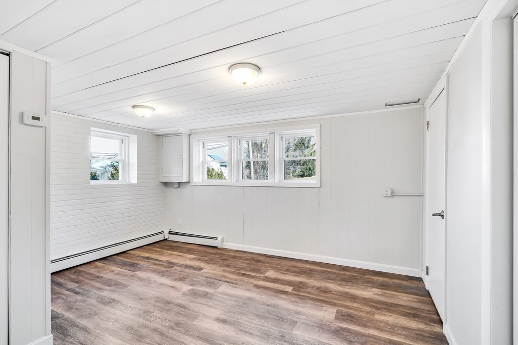 340 Berlin Road Marlborough, MA 01752 - Photo 12 of 42 a view of empty room with wooden floor and fan