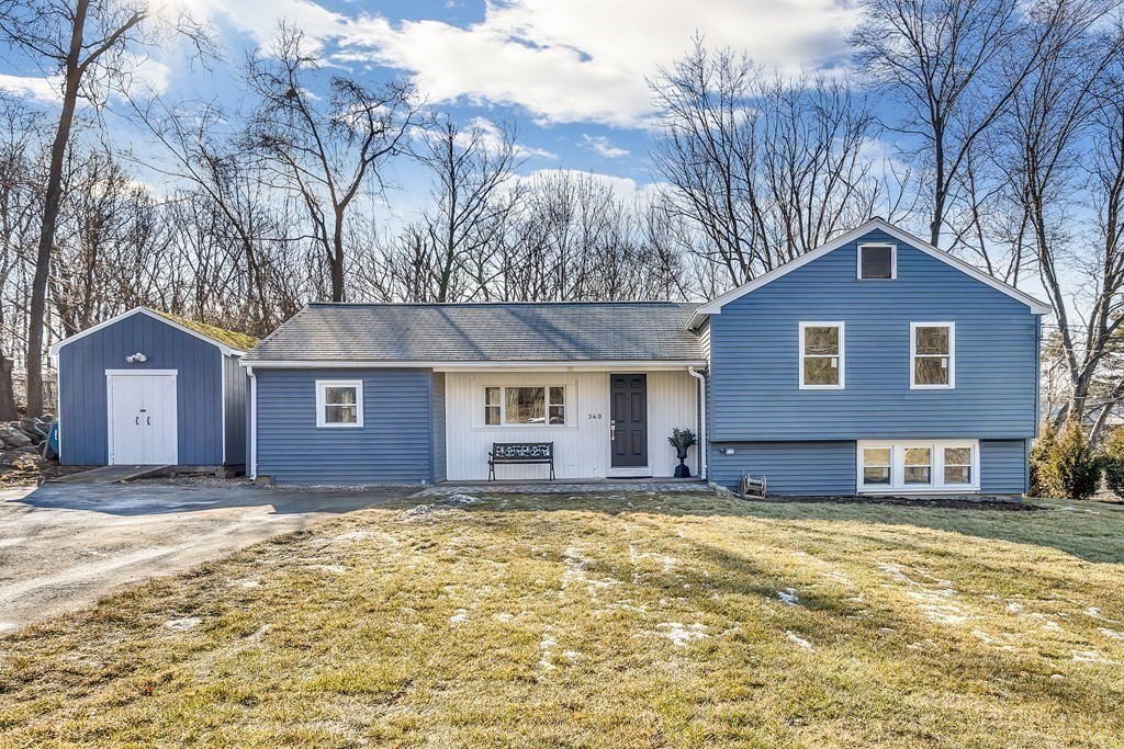 340 Berlin Road Marlborough, MA 01752 - Photo 14 of 42 a front view of a house with a yard