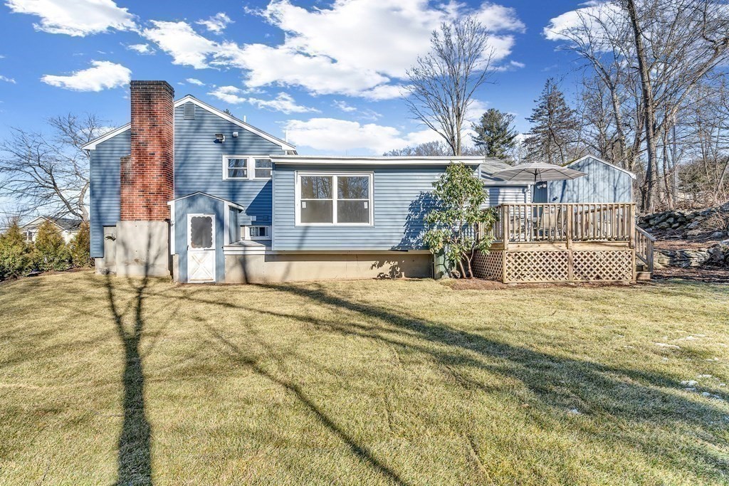 340 Berlin Road Marlborough, MA 01752 - Photo 15 of 42 a front view of a house with a yard and garage