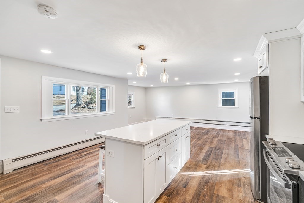 340 Berlin Road Marlborough, MA 01752 - Photo 18 of 42 a view of kitchen with granite countertop cabinets and outdoor space