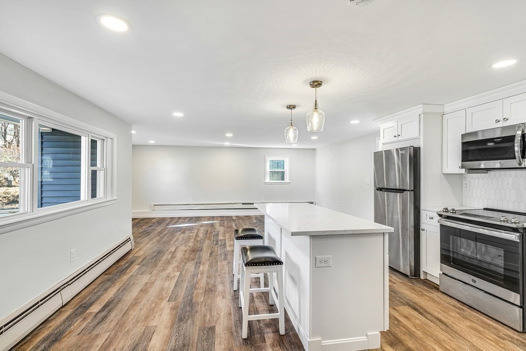 340 Berlin Road Marlborough, MA 01752 - Photo 19 of 42 a view of kitchen with sink microwave and refrigerator