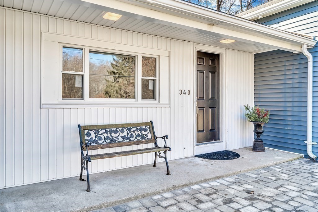 340 Berlin Road Marlborough, MA 01752 - Photo 2 of 42 a view of a house with a bench
