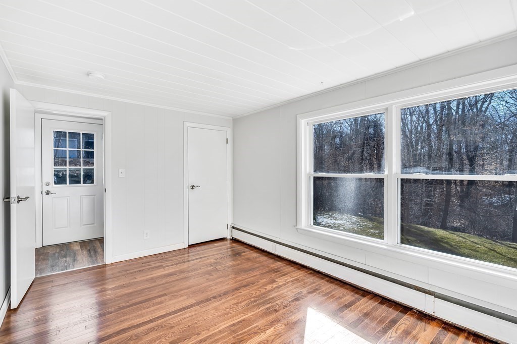 340 Berlin Road Marlborough, MA 01752 - Photo 21 of 42 a view of empty room with wooden floor and fan