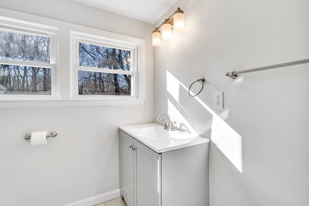 340 Berlin Road Marlborough, MA 01752 - Photo 23 of 42 a bathroom with a sink vanity and a mirror