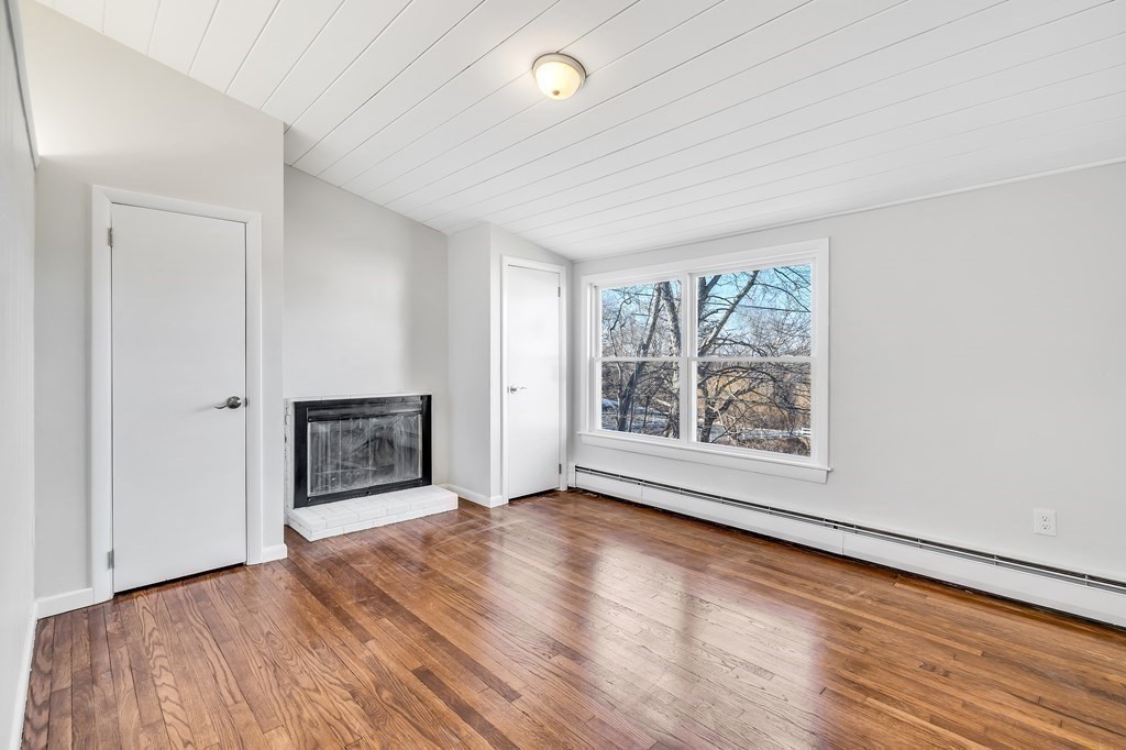 340 Berlin Road Marlborough, MA 01752 - Photo 24 of 42 a view of an empty room with wooden floor and a window