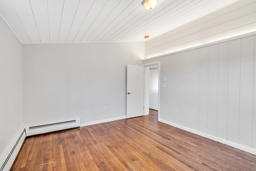 340 Berlin Road Marlborough, MA 01752 - Photo 25 of 42 a view of an empty room with wooden floor