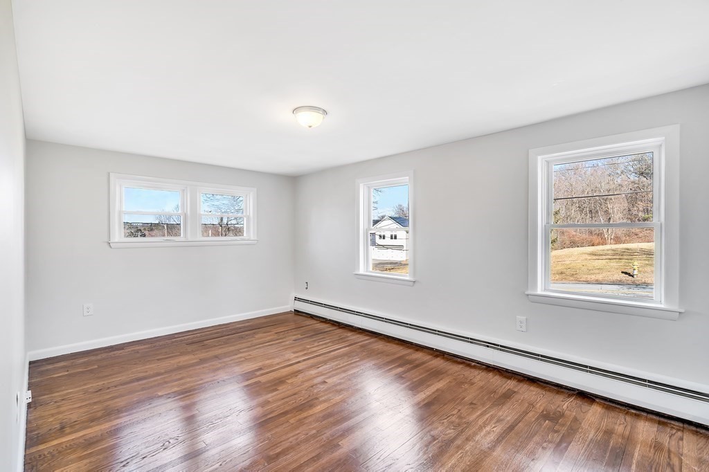 340 Berlin Road Marlborough, MA 01752 - Photo 26 of 42 a view of an empty room with wooden floor and a window