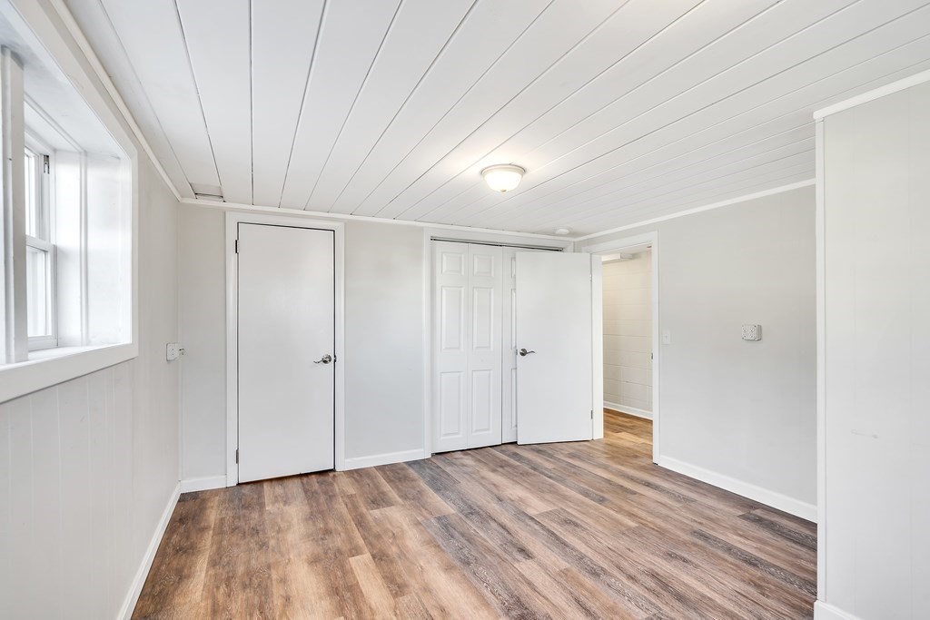 340 Berlin Road Marlborough, MA 01752 - Photo 29 of 42 a view of an empty room with wooden floor and a window