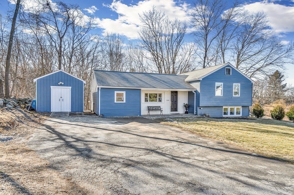 340 Berlin Road Marlborough, MA 01752 - Photo 33 of 42 a view of a house with a yard and garage