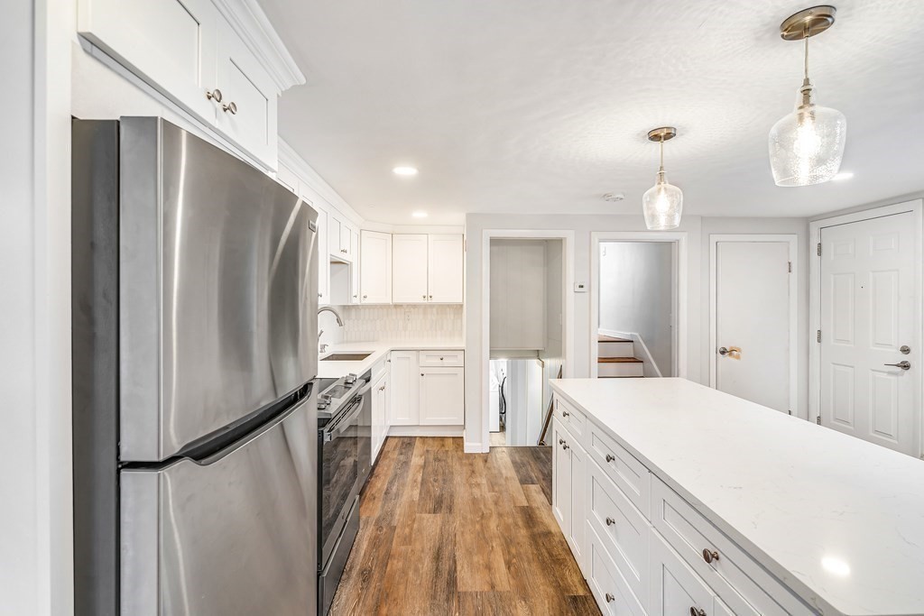340 Berlin Road Marlborough, MA 01752 - Photo 8 of 42 a spacious bathroom with a double vanity sink and a mirror