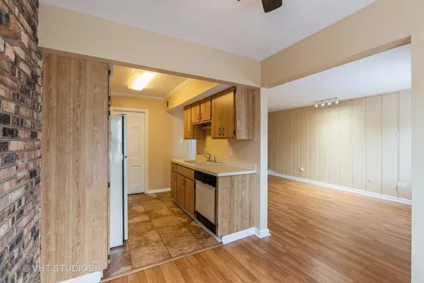 a kitchen with granite countertop a stove and cabinets