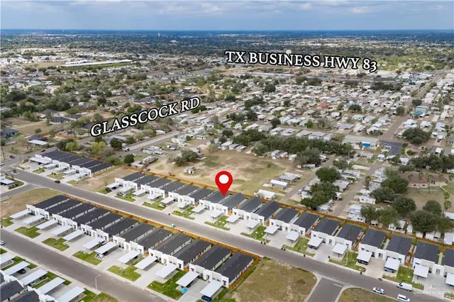 an aerial view of residential building and outdoor space