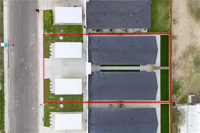 front view of a house next to a yard