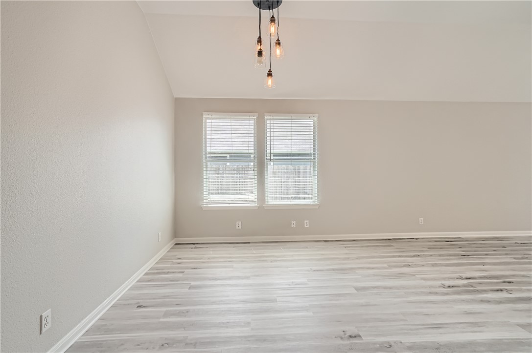 102 Evergreen Circle Georgetown, TX 78626 - Photo 11 of 33 wooden floor in an empty room with a window