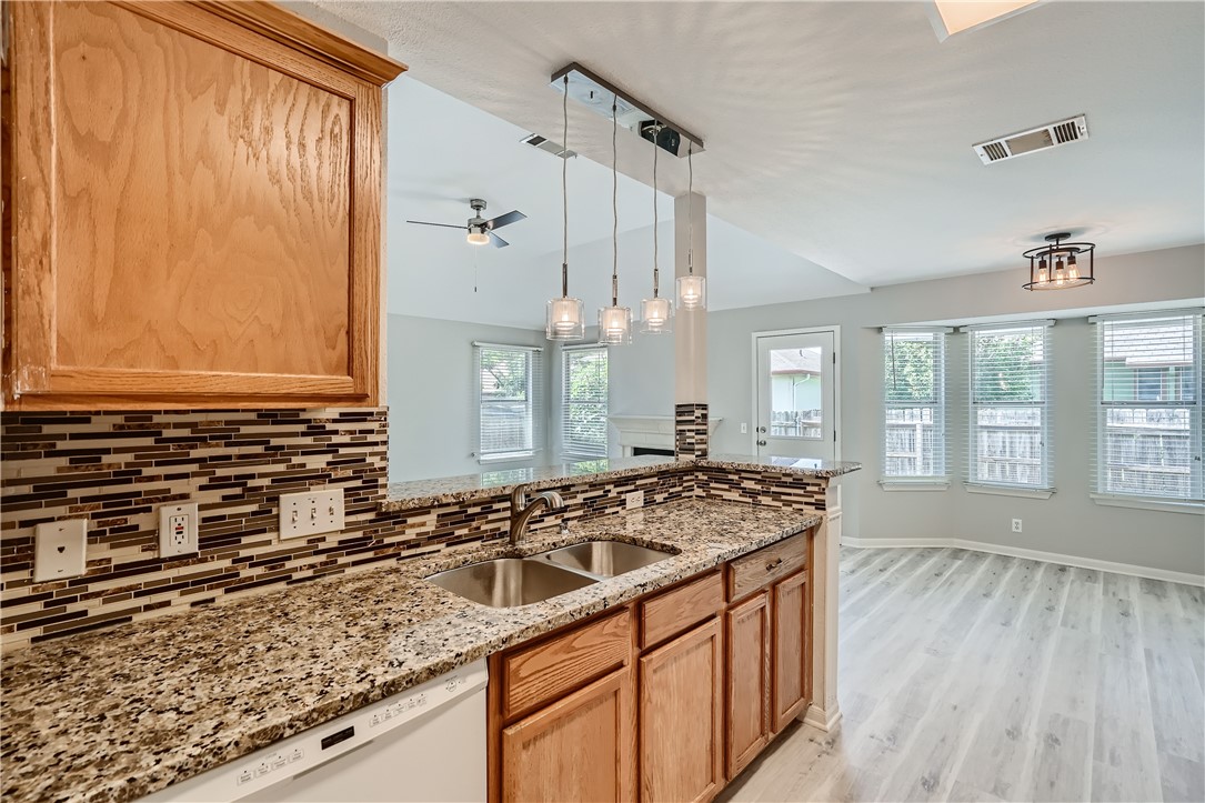 102 Evergreen Circle Georgetown, TX 78626 - Photo 14 of 33 a kitchen with a sink stove and cabinets