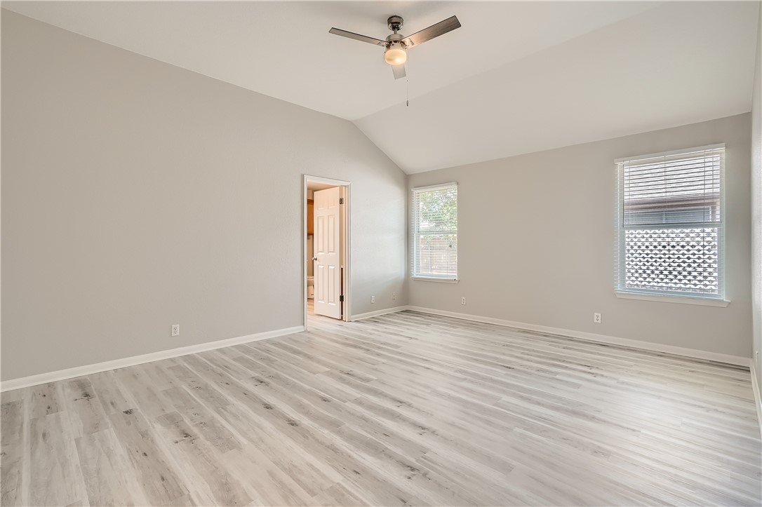 102 Evergreen Circle Georgetown, TX 78626 - Photo 18 of 33 wooden floor in an empty room with a window