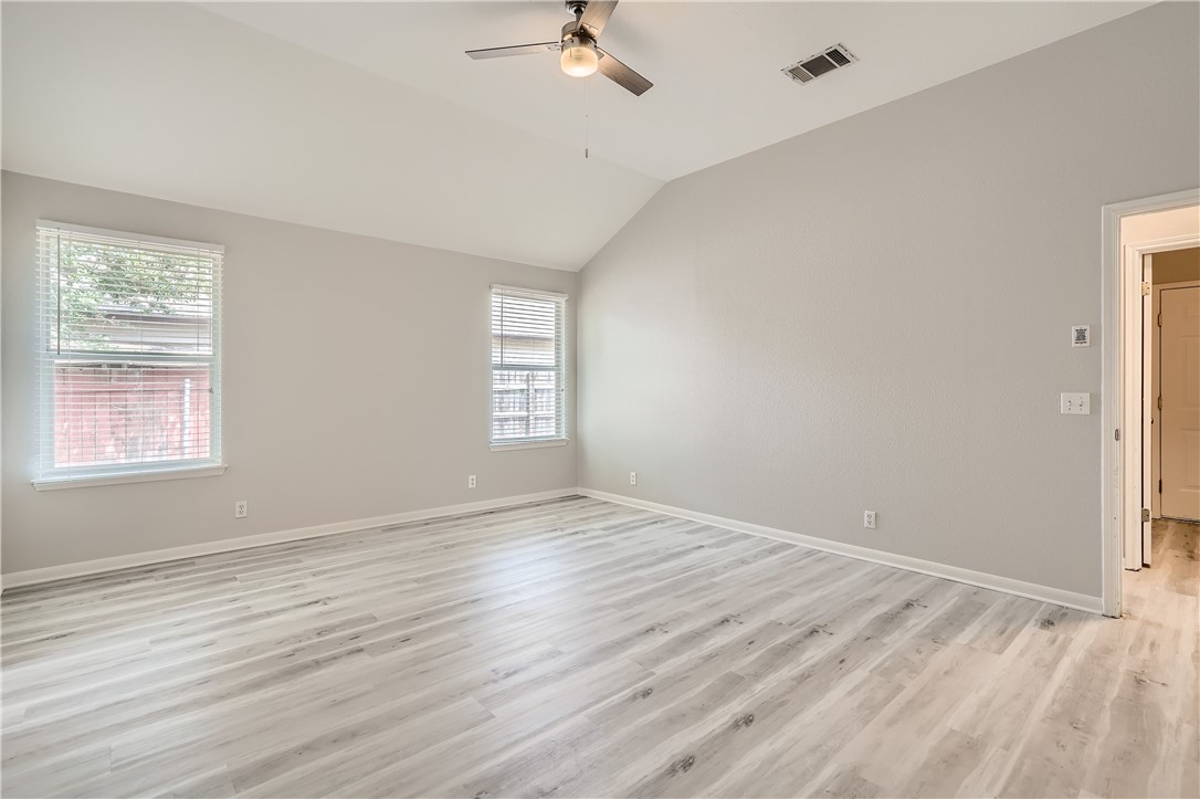 102 Evergreen Circle Georgetown, TX 78626 - Photo 19 of 33 wooden floor in an empty room with a window