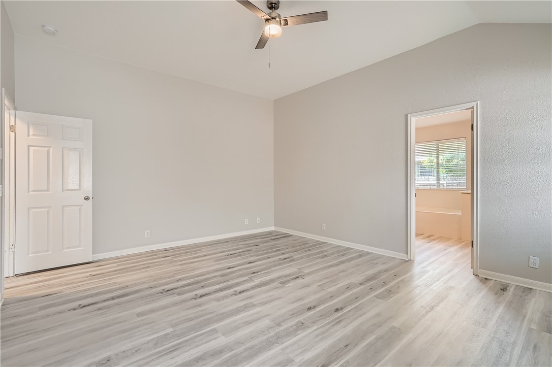 102 Evergreen Circle Georgetown, TX 78626 - Photo 20 of 33 a view of an empty room with wooden floor