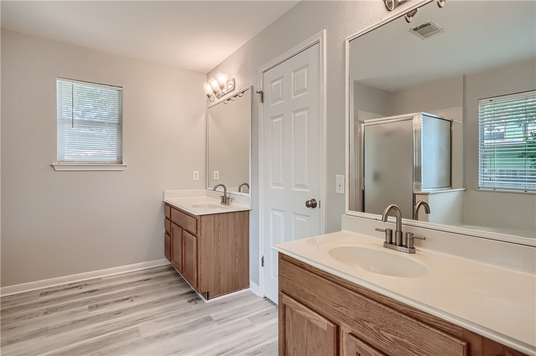 102 Evergreen Circle Georgetown, TX 78626 - Photo 22 of 33 a bathroom with a sink and a mirror