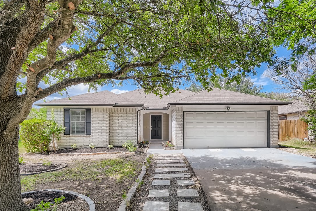 102 Evergreen Circle Georgetown, TX 78626 - Photo 3 of 33 a front view of a house with garden