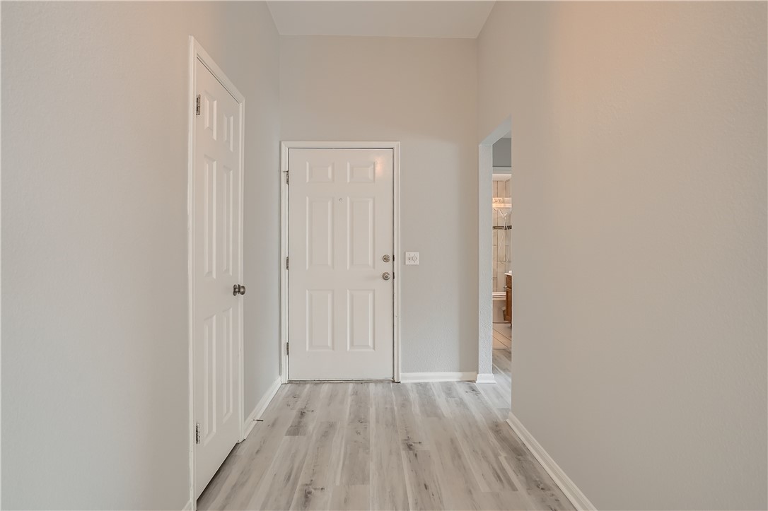102 Evergreen Circle Georgetown, TX 78626 - Photo 7 of 33 a view of a hallway with wooden floor