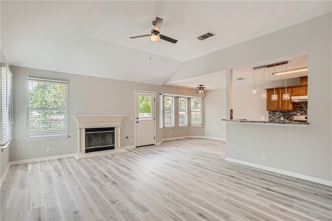 102 Evergreen Circle Georgetown, TX 78626 - Photo 8 of 33 a view of main area fire place window and wooden floor