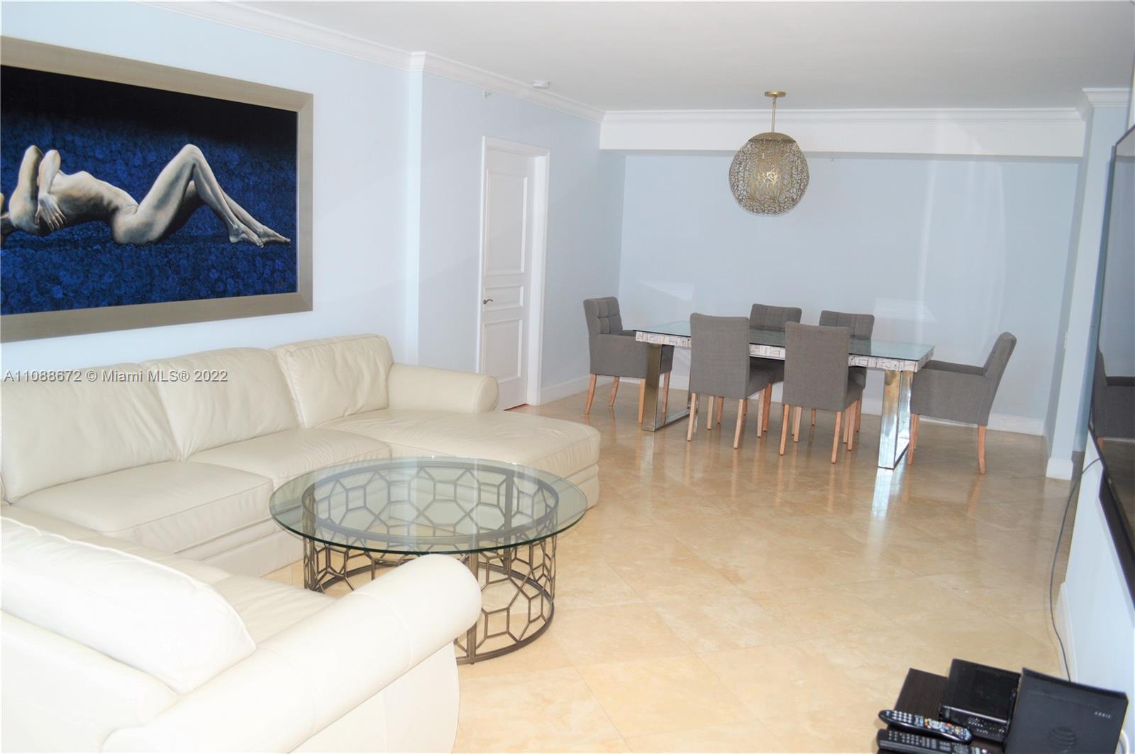 701 Brickell Key Boulevard, Unit 1203 Miami, FL 33131 - Photo 2 of 34 a view of a dining room with furniture