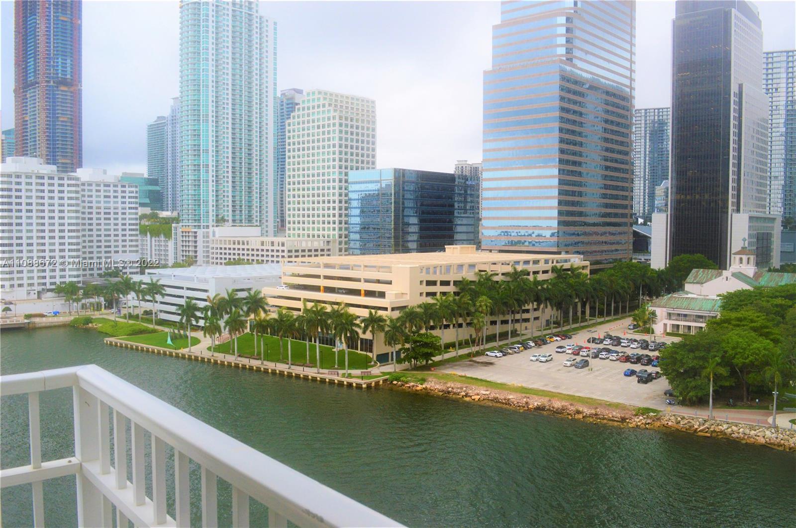 701 Brickell Key Boulevard, Unit 1203 Miami, FL 33131 - Photo 29 of 34 a view of a swimming pool with a lounge chairs