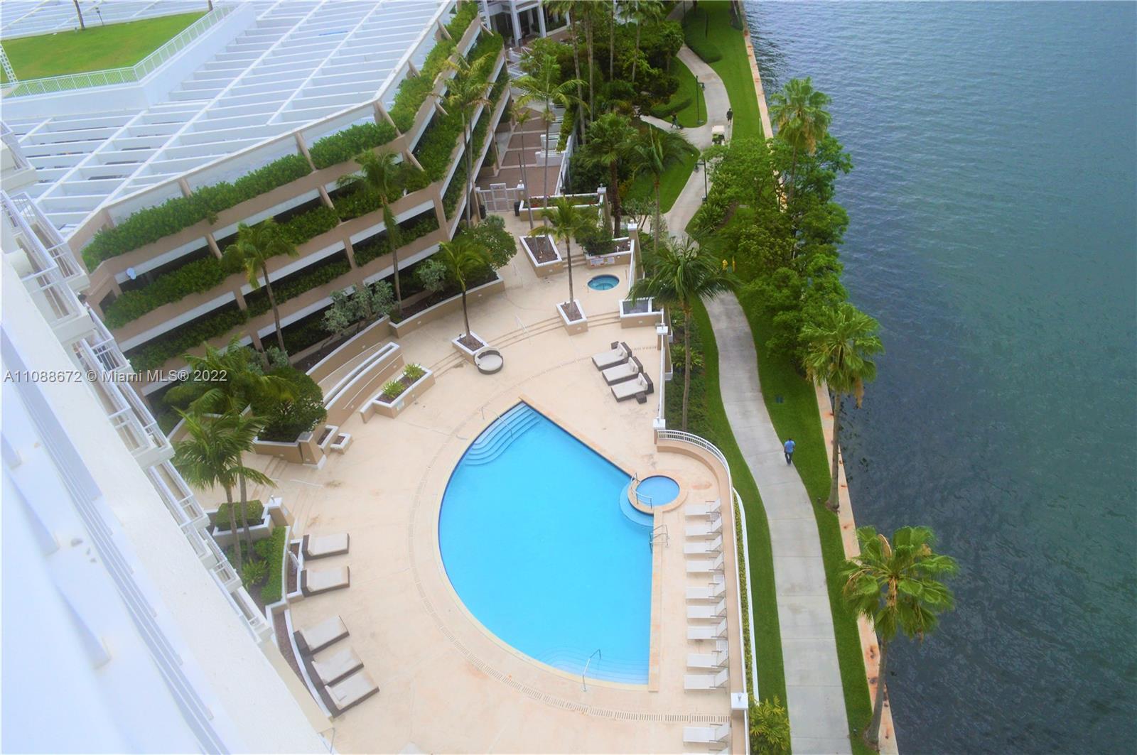 701 Brickell Key Boulevard, Unit 1203 Miami, FL 33131 - Photo 32 of 34 a view of a swimming pool with sitting area
