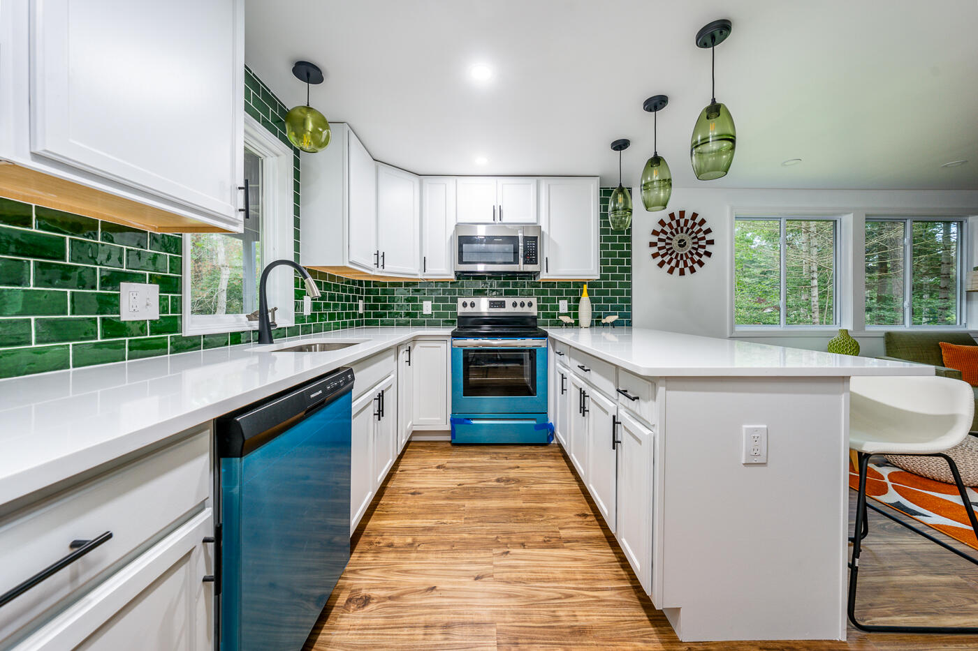 25 Hayes Road Centerville, MA 02632 - Photo 6 of 29 a kitchen with stainless steel appliances a white cabinets and wooden floor