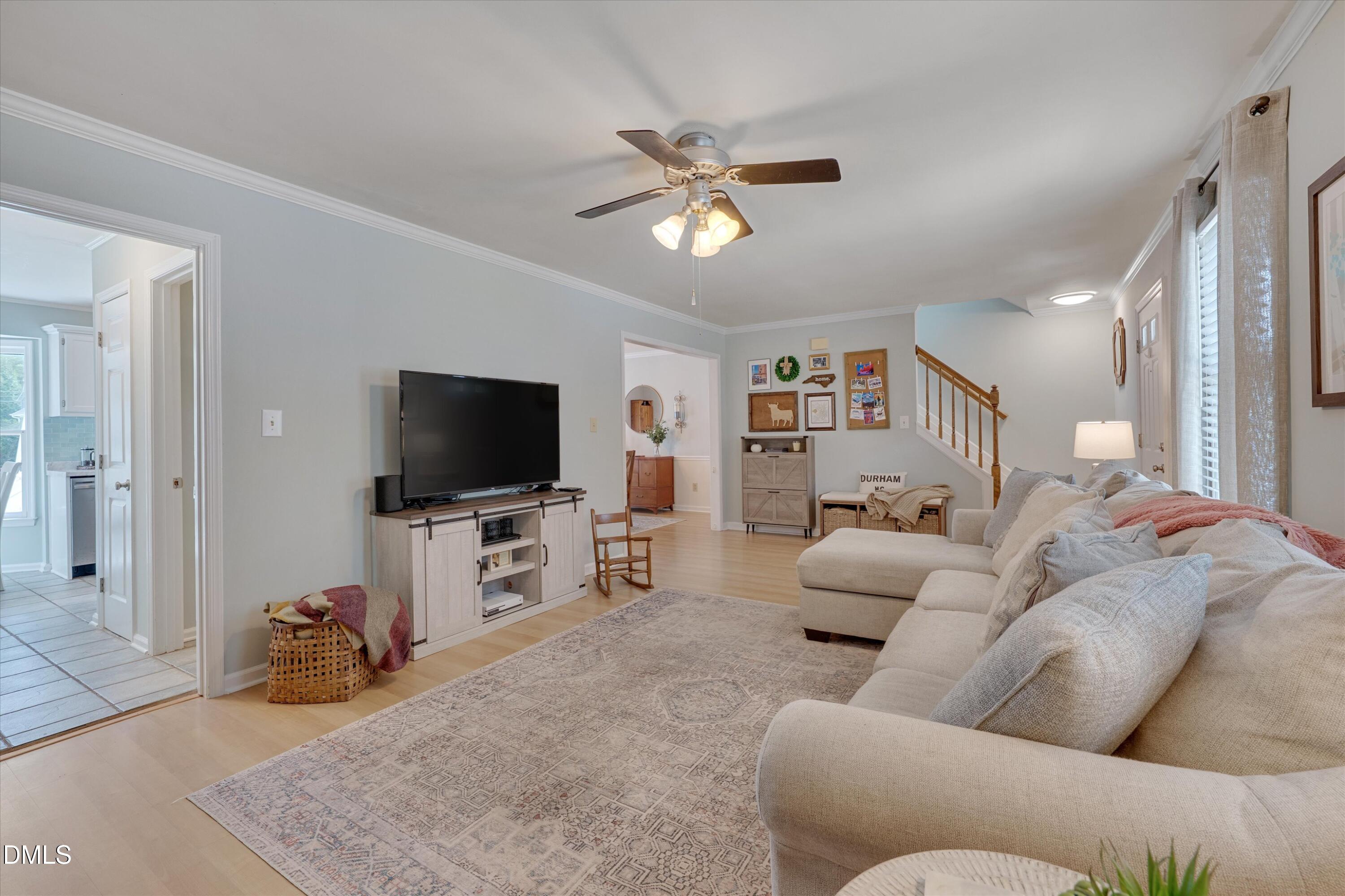3301 Lassiter Street Durham, NC 27707 - Photo 8 of 32 a living room with furniture and a flat screen tv