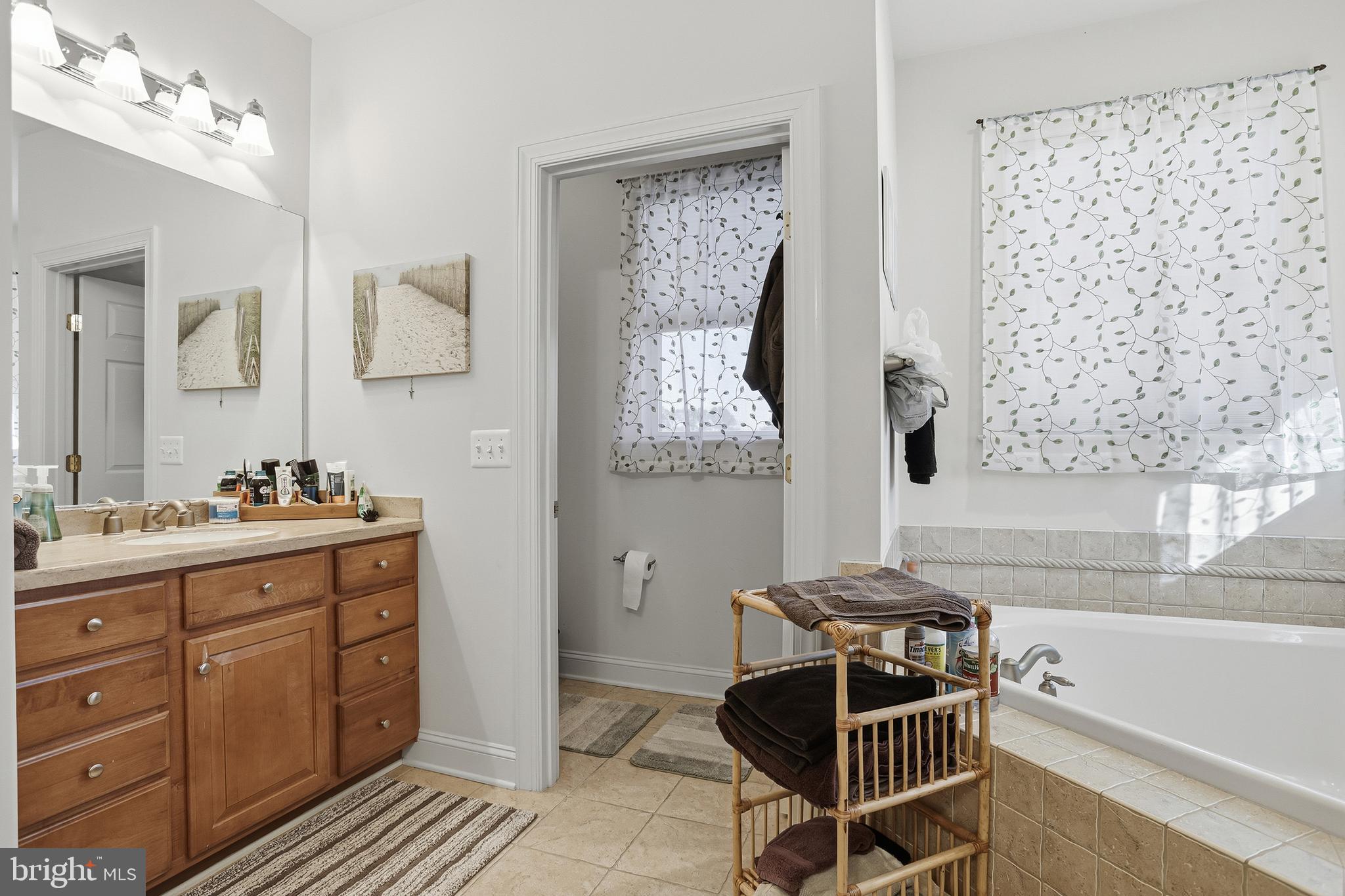 40 Branson Cove Road Hague, VA 22469 - Photo 25 of 51 a bathroom with a tub sink and mirror