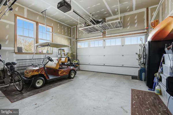 a view of a garage with parked cars