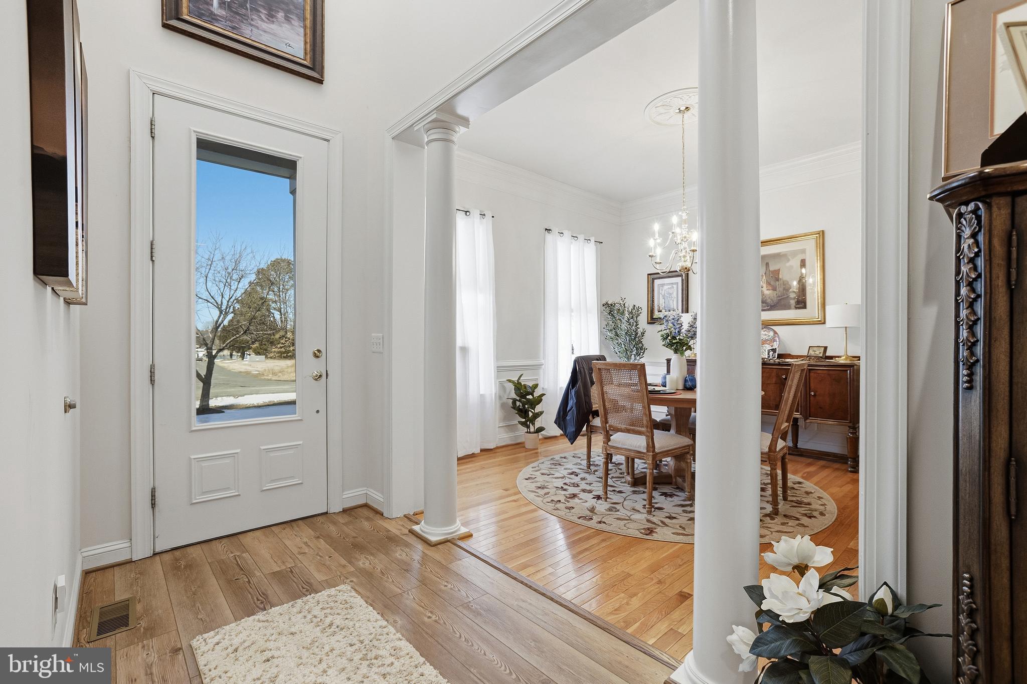 40 Branson Cove Road Hague, VA 22469 - Photo 4 of 51 wooden floor to ceiling window and dining room