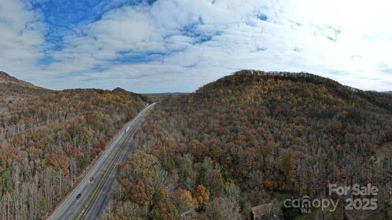 5-acres 5-acres Blue Ridge Trail Columbus, NC 28722 - Photo 20 of 21 a view of a dry yard with mountains in the background