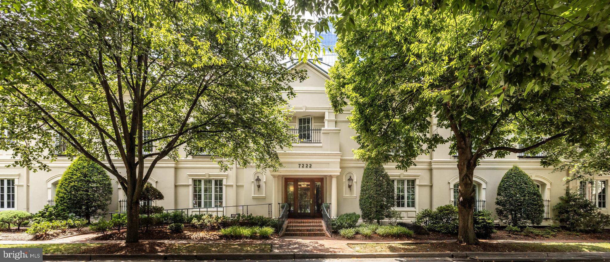 7222 47th Street, Unit R2 Bethesda, MD 20815 - Photo 1 of 26 front view of a house with a tree