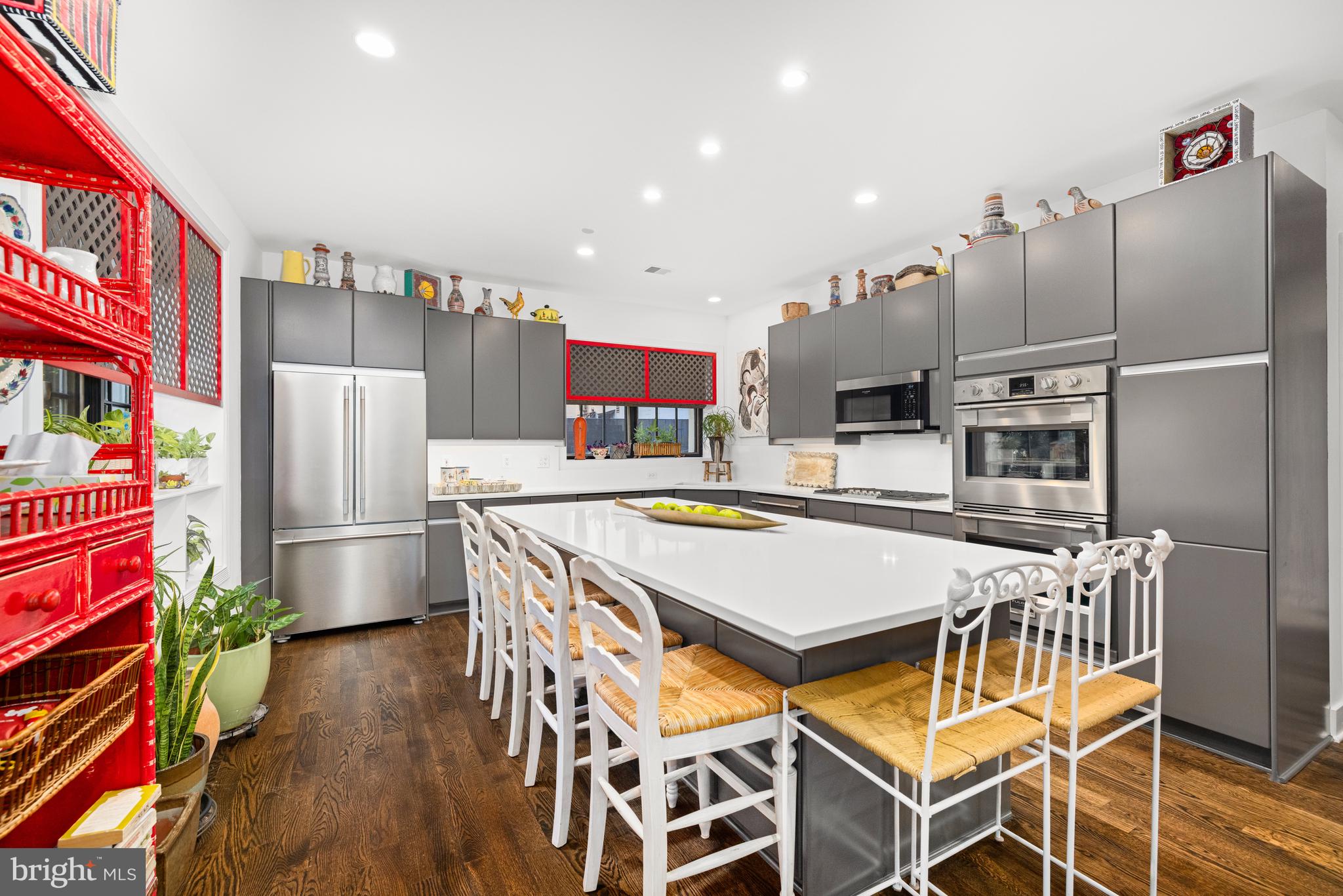7222 47th Street, Unit R2 Bethesda, MD 20815 - Photo 11 of 26 a kitchen with stainless steel appliances a refrigerator and a stove top oven