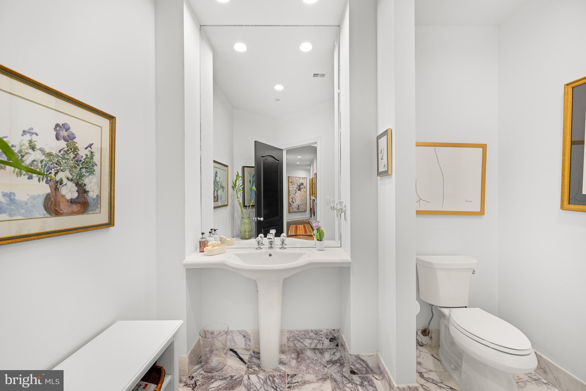 7222 47th Street, Unit R2 Bethesda, MD 20815 - Photo 14 of 26 a bathroom with a sink mirror and toilet