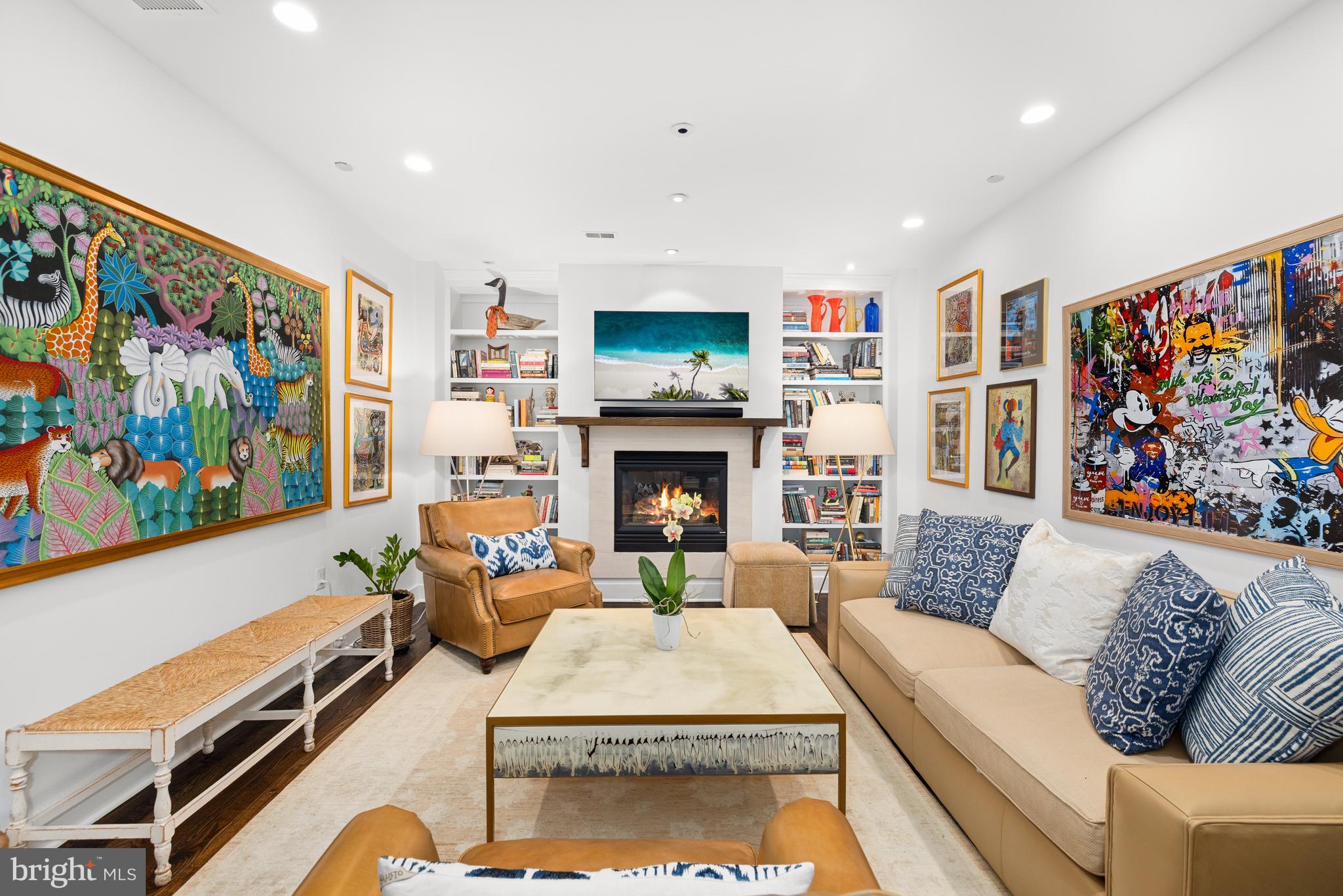 7222 47th Street, Unit R2 Bethesda, MD 20815 - Photo 15 of 26 a living room with furniture a flat screen tv and a fireplace