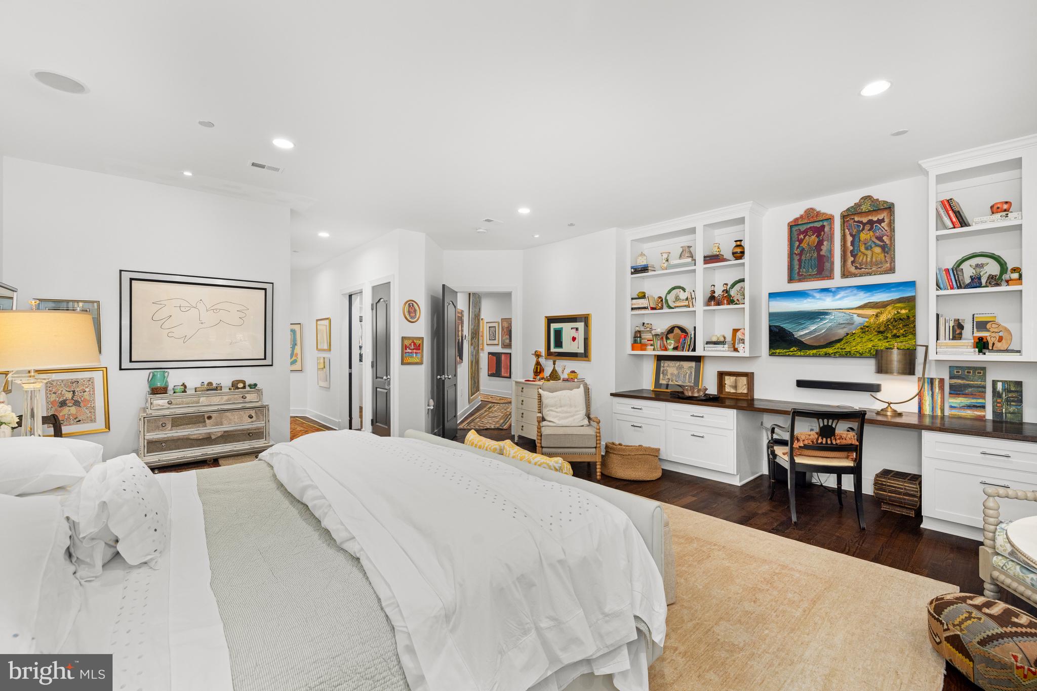 7222 47th Street, Unit R2 Bethesda, MD 20815 - Photo 17 of 26 a bedroom with a bed furniture and a flat screen tv