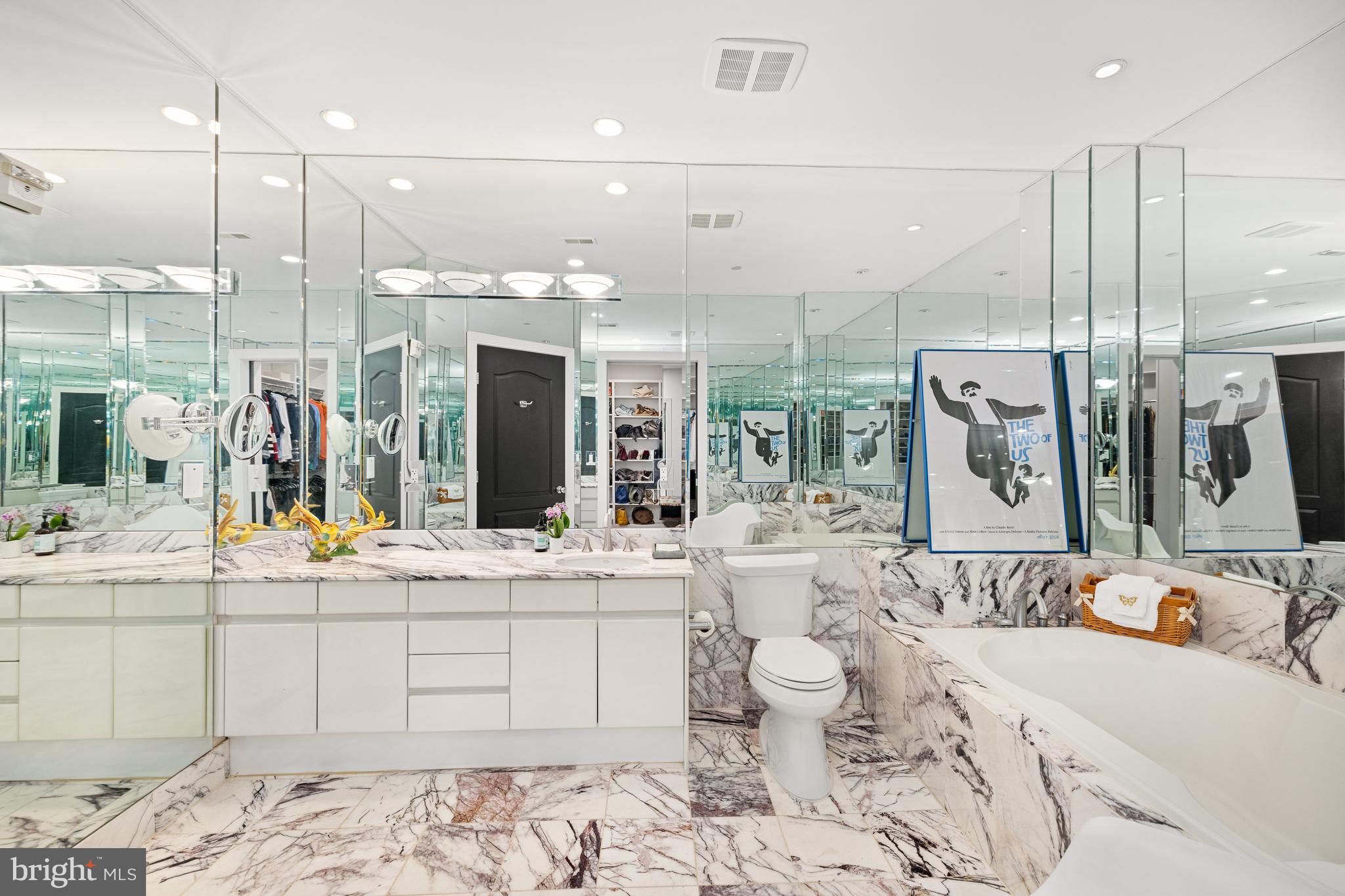 7222 47th Street, Unit R2 Bethesda, MD 20815 - Photo 18 of 26 a bathroom with a double vanity sink mirror and bathtub