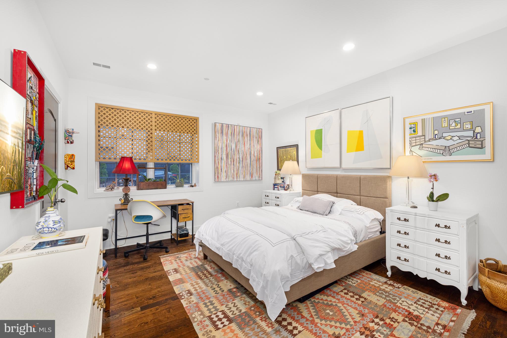 7222 47th Street, Unit R2 Bethesda, MD 20815 - Photo 20 of 26 a bedroom with a bed a dresser and painting on the wall