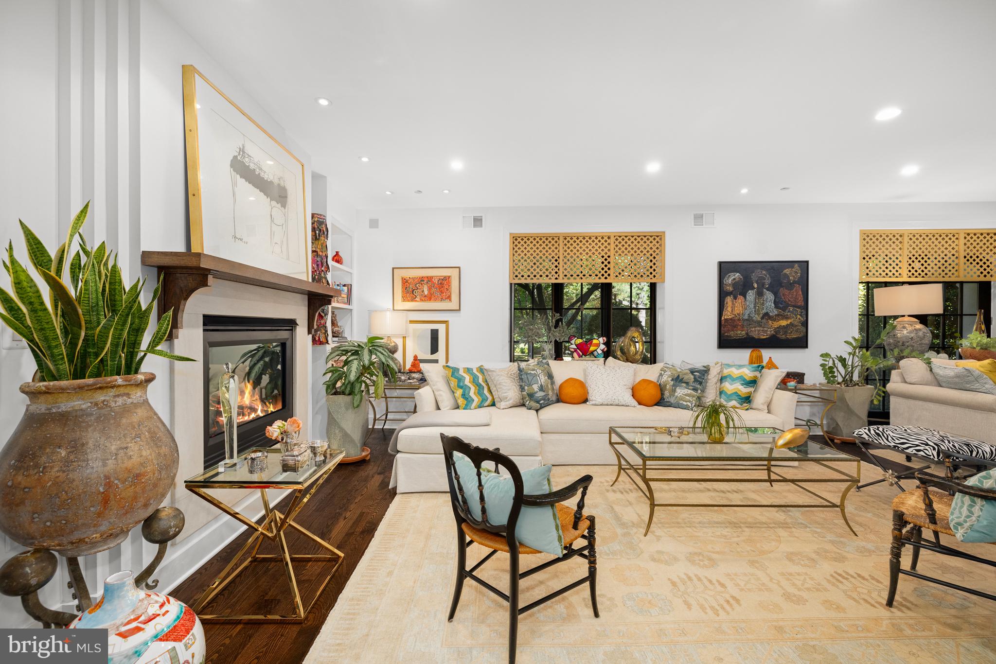 7222 47th Street, Unit R2 Bethesda, MD 20815 - Photo 5 of 26 a living room with fireplace furniture dining table and a fireplace