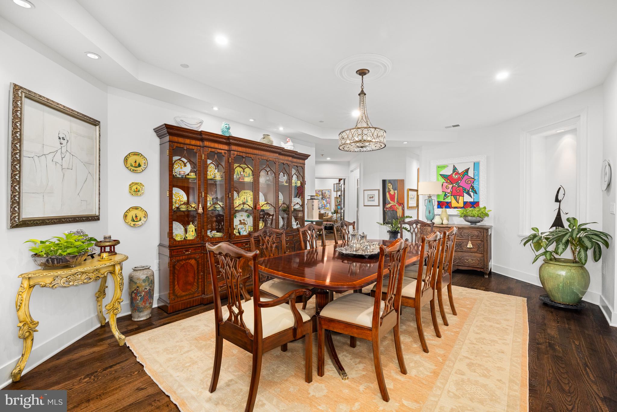 7222 47th Street, Unit R2 Bethesda, MD 20815 - Photo 8 of 26 a view of a dining room with furniture wooden floor and chandelier