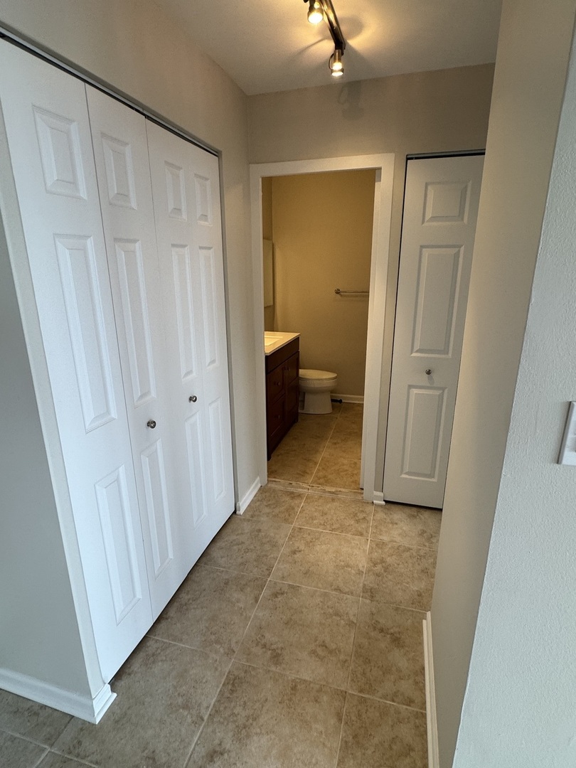 5701 North Sheridan Road, Unit 17S Chicago, IL 60660 - Photo 6 of 8 a view of a closet in a bathroom